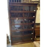 An early 20th century Gunn oak six section bookcase, length 126cm, depth 29cm, height 208cm