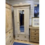 An Edwardian pine mirrored door wardrobe, length 94cm, depth 49cm, height 211cm