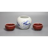 A Chinese blue and white water pot and two sang de boeuf glazed cups, tallest 9cm