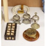 Three table bells, a porcupine quill box, a table compass and a Royal Doulton baby's plate