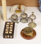Three table bells, a porcupine quill box, a table compass and a Royal Doulton baby's plate