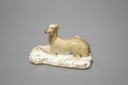 A Grainger, Lee & Co., Worcester porcelain greyhound, cushion base, c.1830, width 10cmCONDITION: