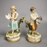 A pair of Capodimonte figures, Boy with Rabbit and Girl with Doves, height 24cm