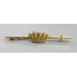 An Edwardian 15ct, enamel and seed pearl set coronet bar brooch, 46mm, gross 2.7 grams.