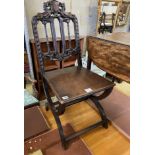 An Arts & Crafts carved oak side chair