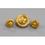 A Victorian yellow metal circular mourning brooch with foliate motif, 28mm and a pair of matching