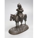 A late 19th century Russian cast iron group of a cossack on horseback