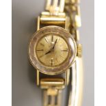 A lady's 1960's 18ct gold Omega manual wind wrist watch, on a gold plated bracelet with box and