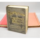 A Stanley Gibbons red stamp album and two others, each mounted with an accumulation of all world