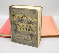 A Stanley Gibbons red stamp album and two others, each mounted with an accumulation of all world