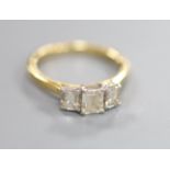 An emerald cut three-stone diamond ring, 18ct yellow and white gold setting, original box and