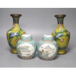 A pair of 20th century Chinese export ginger jars, decorated with vignettes of landscapes over a
