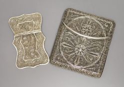 A Chinese filligree white metal card case, 84mm and a similar swivel action cigarette case, 97mm.