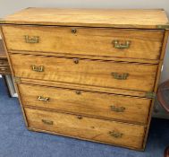 A 19th century two sectional fruitwood campaign chest, of four long drawers, brass capped with flush