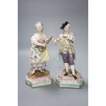 A pair of 19th century German porcelain figures, height 25cm