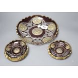 A late 19th century Bohemian intaglio cut and gilded glass dish and six saucers
