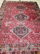 A Hamadan red ground carpet, 290 x 216cm