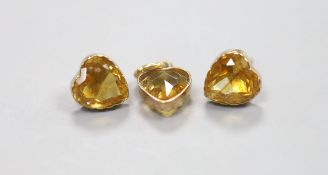 A yellow metal and heart shape citrine pendant, 10mm and pair of matching ear studs(no butterflies),