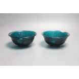 A pair of Chinese Beijing green glass bowls, Qianlong four character and of the period, diameter