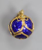 A 19th century engraved yellow metal and blue enamel set sphere pendant, 16mm, gross 7.7 grams.