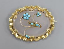 An early 20th century yellow metal mounted, white chalcedony and turquoise set oval brooch, 44mm,