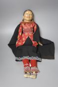 A European folk art papier mache head doll, beadwork costume, height 55cm