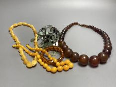 A pale yellow amber bead necklace, 56cm, gross 45 grams and other necklaces including simulated
