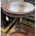 A 19th century Anglo / Indian carved padouk circular tilt top table, 60cm diameter, height 74cm