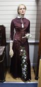 A 1950's full length shop mannequin and a similar together with a Victorian brown silk dress and