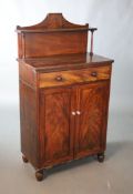A small Regency mahogany chiffonier, with single shelf raised back, frieze drawer and two panelled
