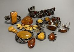 A mixed group of amber jewellery including white metal mounted bangle and Portuguese 925 bracelet.