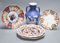 A Wedgwood jasperware "Portland" vase, 19th century, height 21cm, and four Victorian plates to