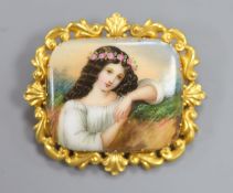 A yellow metal mounted porcelain plaque brooch, painted with a young maiden, 57mm, gross 18.9