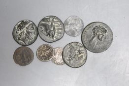 A Roman silver denarius, a hammered silver coin and various reproduction Roman coins.