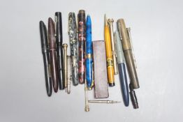 A group of fountain pens, pencils etc