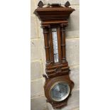 An Edwardian carved oak aneroid barometer and thermometer, height 80cm