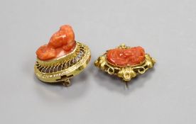 Two 19th century yellow metal and coral set oval brooches (one adapted from a clasp?), each coral