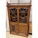 A Victorian walnut glazed bookcase cabinet, width 113cm, depth 33cm, height 184cm