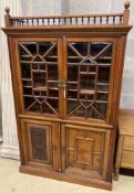 A Victorian walnut glazed bookcase cabinet, width 113cm, depth 33cm, height 184cm