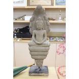 A large Cambodian stone figure of Buddha, on stand, height 71cm