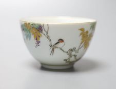 An unusual Japanese Kinkozan porcelain tea bowl, six character mark to base, painted with a bird