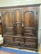 A mid 18th century oak panelled two part hanging cupboard, width 156cm, depth 53cm, height 188cm