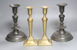 A pair of 18th century pewter candlesticks and a later brass pair, tallest 25cm