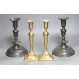 A pair of 18th century pewter candlesticks and a later brass pair, tallest 25cm