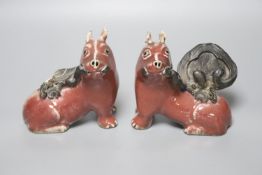 A pair of unusual Chinese copper red glazed 'pig' incense burners/ joss stick holders, late Qing