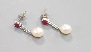 A modern pair of 750 white metal, ruby, diamond chip and cultured pearl set drop earrings, 22mm,
