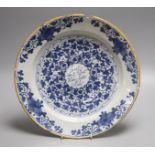 An 18th century Dutch delft charger, diameter 35cm (a.f.)