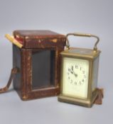 An early 20th century French lacquered brass carriage clock, with enamelled dial, cased, overall