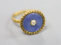A yellow metal, blue guilloche enamel and diamond set 'button' ring, size K, gross 3.1 grams (