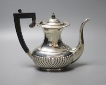 A George V demi fluted silver coffee pot, S. BLanckensee & Sons, Birmingham, 1930, height 17.8cm,